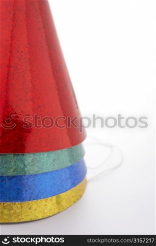Colored Party Hats Against White Background