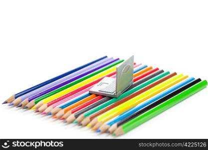 colored pencils and miniature laptop isolated on white