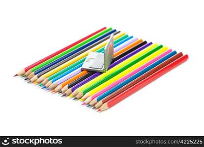 colored pencils and miniature laptop isolated on white