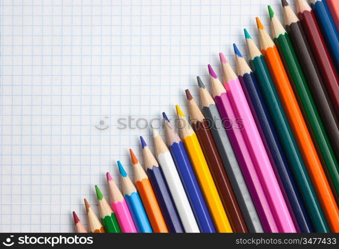 colored pencils at school notebook