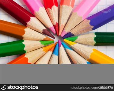 colored pencils at school notebook