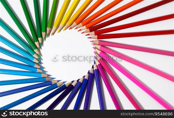 Colored pencils forming a round frame with white empty blank copy space. Color pencils concept for creative artwork, drawing and artistic school.