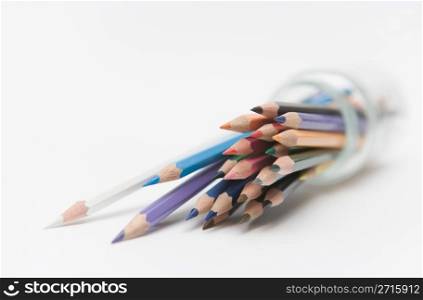 Colored pencils in a glass jar