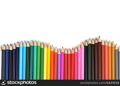 Colored pencils lined up in row