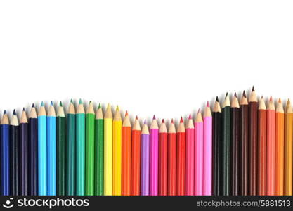 Colored pencils lined up in row