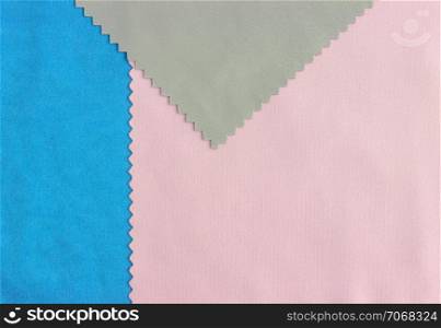 Colored pieces of fabric samples closeup - can be used as a textile textural background with space for copy. . Colored Fabric Texture Background