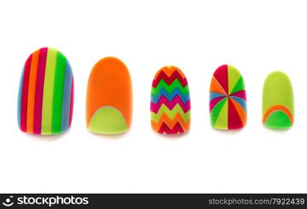 Colored, plastic artificial nails on a white background