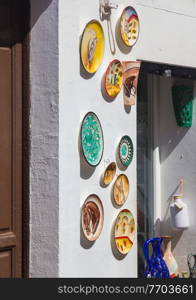 colored plates decorating a white wall