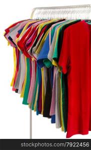 Colored shirts on hangers in a row. Isolate on white.