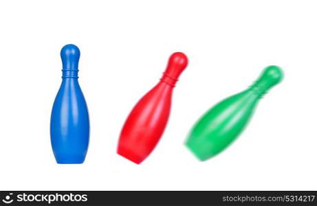 Colored skittles falling on an isolated white background.