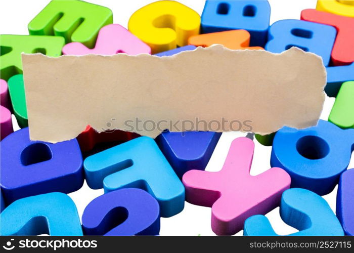 Colored wooden letters of the English alphabet on a white background, copy space