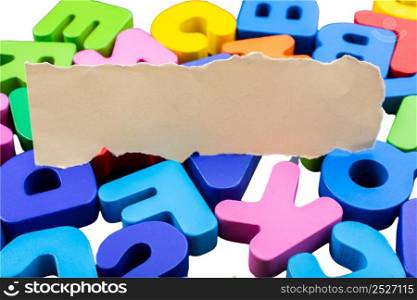 Colored wooden letters of the English alphabet on a white background, copy space
