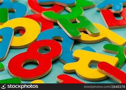 Colored wooden numbers and letters for school children