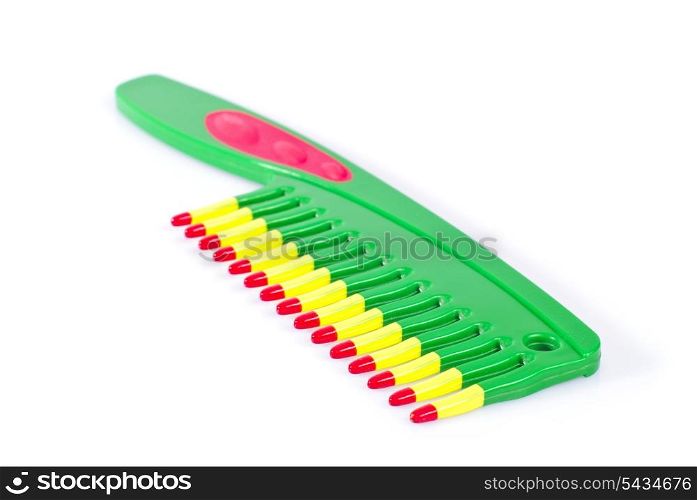 Colorfool vivid comb isolated on white background with shadow. Shallow deep of field