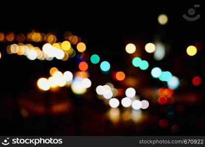 colorful abstract bokeh lights in the street in the city at night