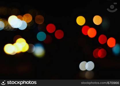 colorful abstract bokeh lights in the street in the city at night