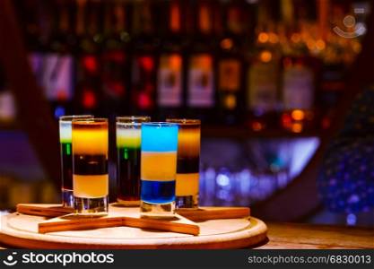 Colorful alcohol shot drinks on bar. cocktail