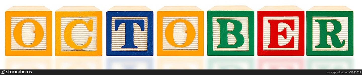 Colorful alphabet blocks spelling October on white