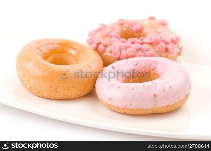 Colorful and delicious donut in white plate