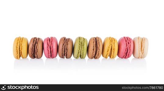 Colorful and tasty French Macarons on white background