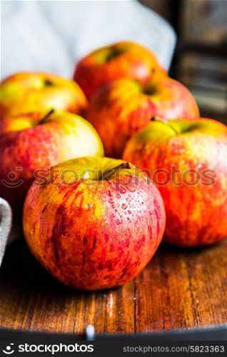 Colorful apples on wooden background