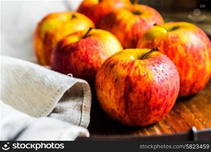 Colorful apples on wooden background