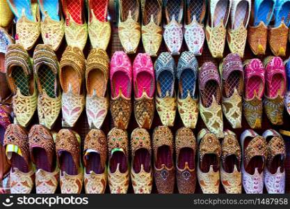 Colorful arabian babouches shoes at market stall