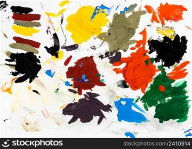 colorful artist pallete with hardened blots of tempera paints on white paper