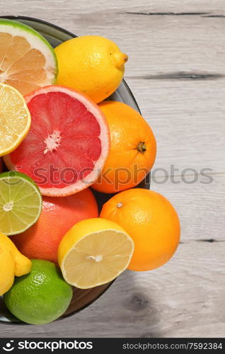 Colorful Assortment Of Citrus Fruit on Wooden Table