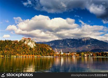 Colorful autumn day on Bled lake, Slovenia. Amazing View On Bled Lake With Mountain Range. Slovenia, Europe