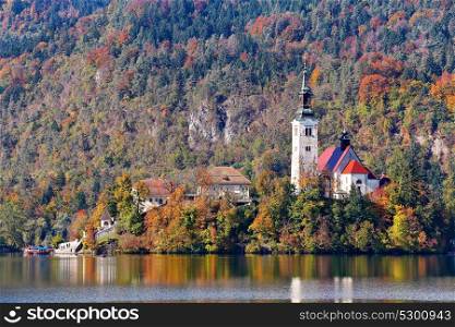 Colorful autumn day on Bled lake, Slovenia. Amazing View On Bled Lake With Mountain Range. Slovenia, Europe
