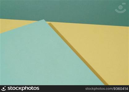 Colorful background from green and yellow paper with shadow. Abstract geometric. The colorful background from green and yellow paper with shadow. Abstract geometric
