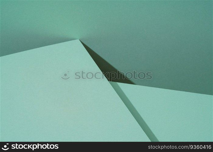 Colorful background from green paper with shadow. Abstract geometric. The colorful background from green paper with shadow. Abstract geometric