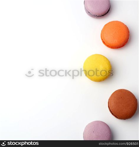 colorful baked macaron almond flour on a white background, copy space, flat lay