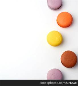 colorful baked macaron almond flour on a white background, copy space, flat lay