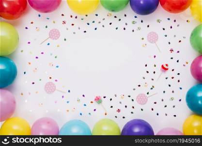 colorful balloons border with confetti props white background. High resolution photo. colorful balloons border with confetti props white background. High quality photo