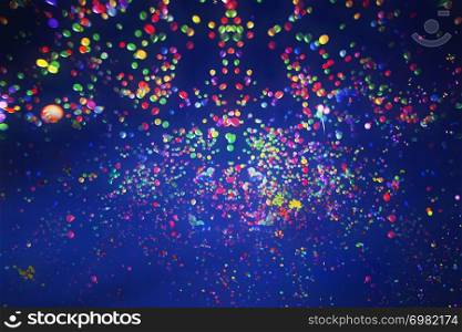 Colorful balloons flying into the blue sky at night. Holiday, festival and party background.