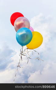 Colorful balloons on a blue sky background