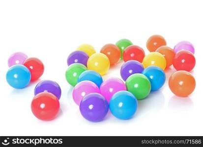 colorful balls in front of white background