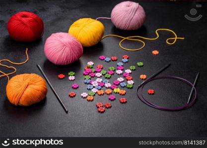 Colorful balls of wool on concrete table. Variety of yarn balls, view from above. Colorful balls of wool on concrete table. Variety of yarn balls