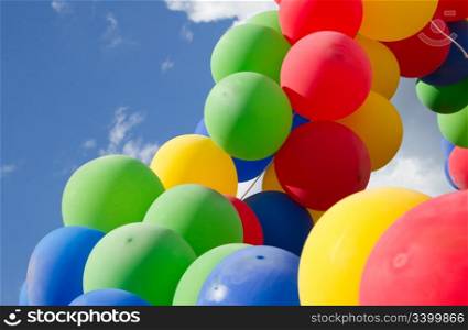 Colorful balls on a background blue sky
