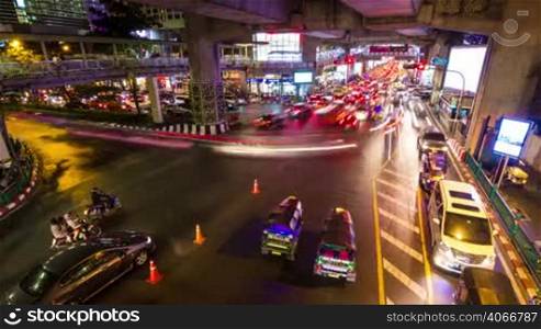 Colorful Bangkok traffic under bridge time lapse