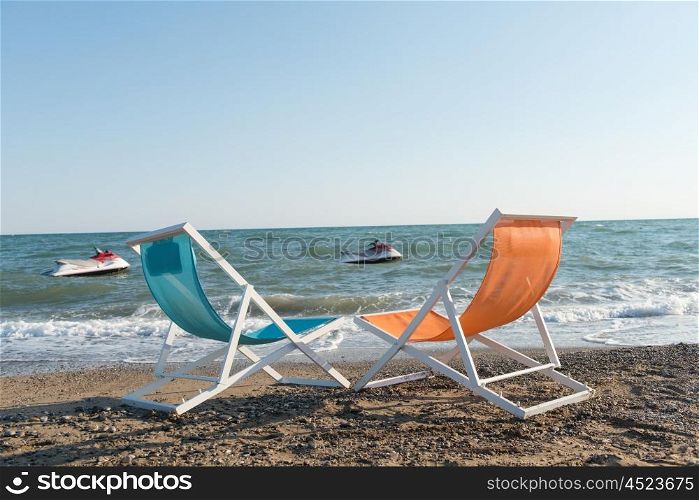 colorful beach chairs at beautiful summer day