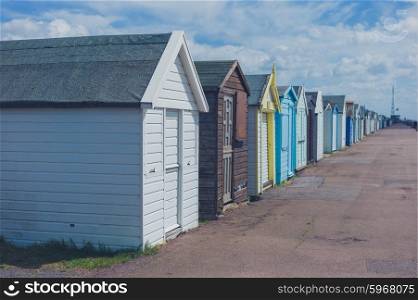Colorful beach huts by the seaside on a sunny day