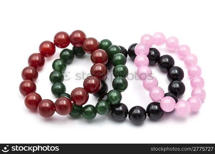 Colorful bead bracelets isolated on white background