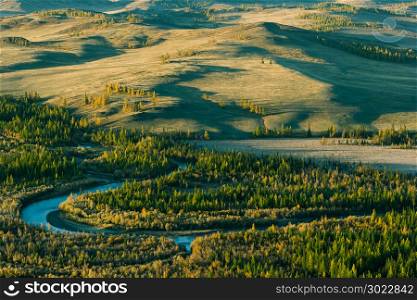 Colorful bend of the river in the forest valley. Beautiful view of Altai.