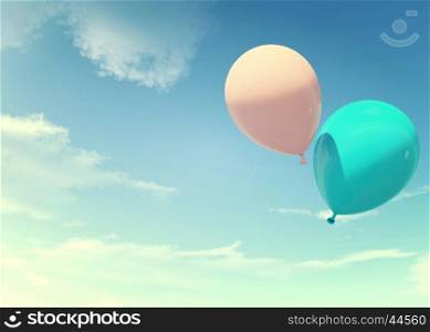 Colorful blue and pink balloons floating in summer holidays in pastel color filter, concept of summer, holidays, and joyful