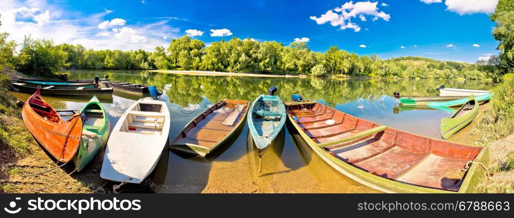 Colorful boats on Mura Drava mouth pannoramic view, Podravina, Croatia