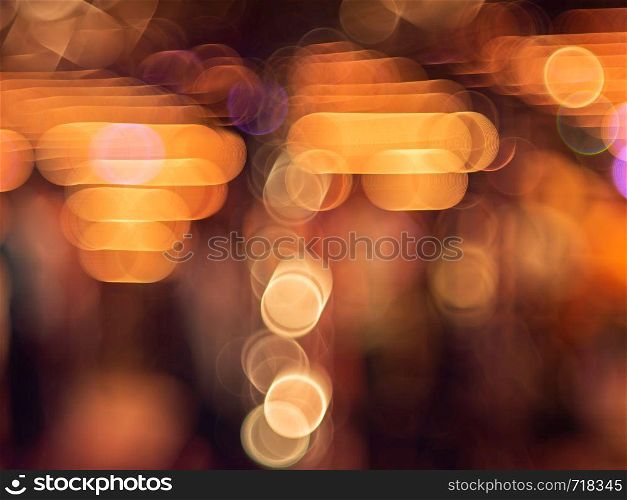 Colorful bokeh a defocus of light at night. Contrast of color warm and cool.