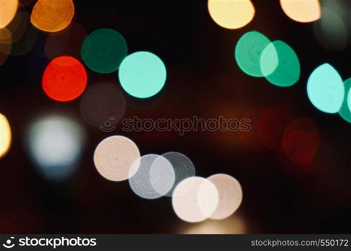 colorful bokeh lights in the street at night